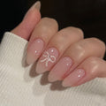 Ivory Bow short nude press-on nails