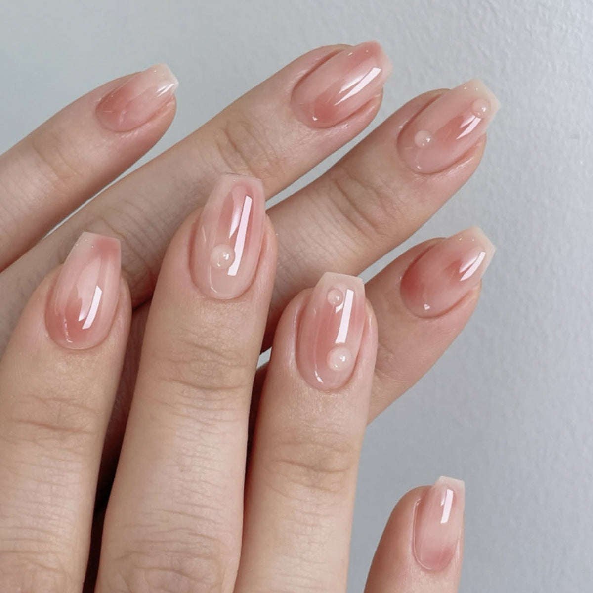 Neutral Nude Glow almond press-on nails