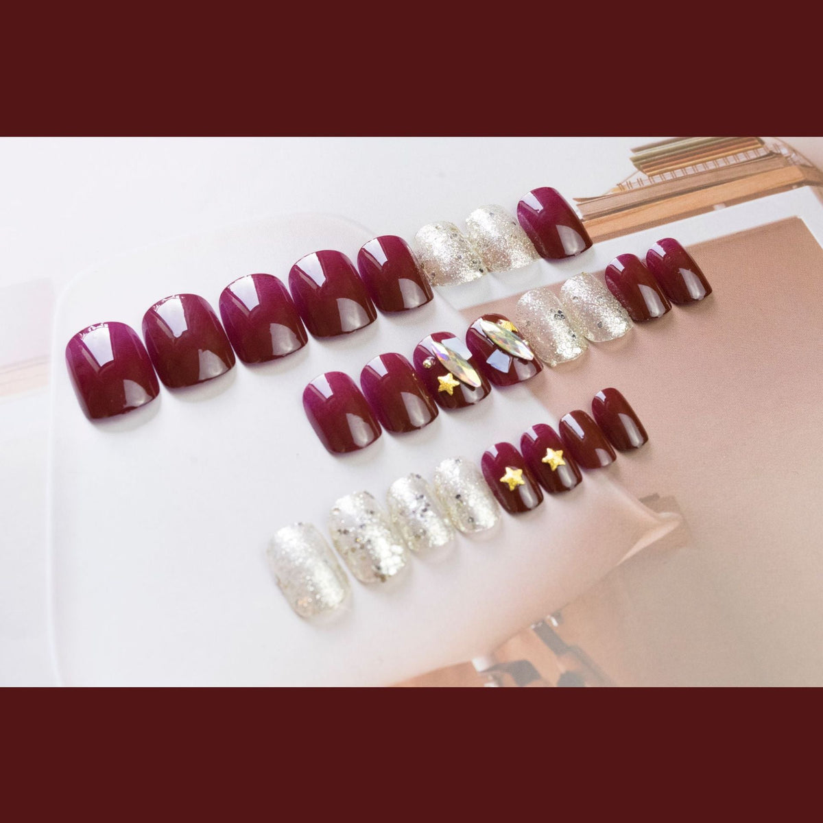 Burgundy Star Shell glossy celestial press-on nails