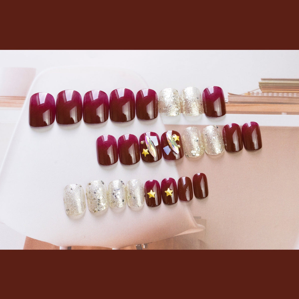 Burgundy Star Shell glossy celestial press-on nails