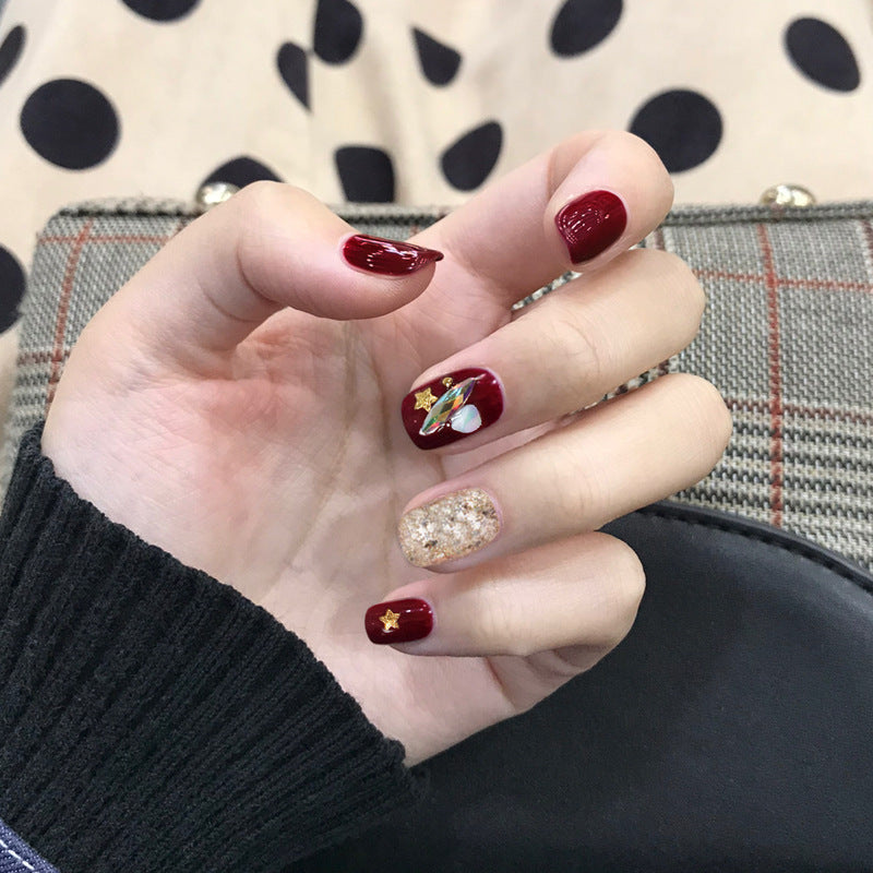 Burgundy Star Shell glossy celestial press-on nails